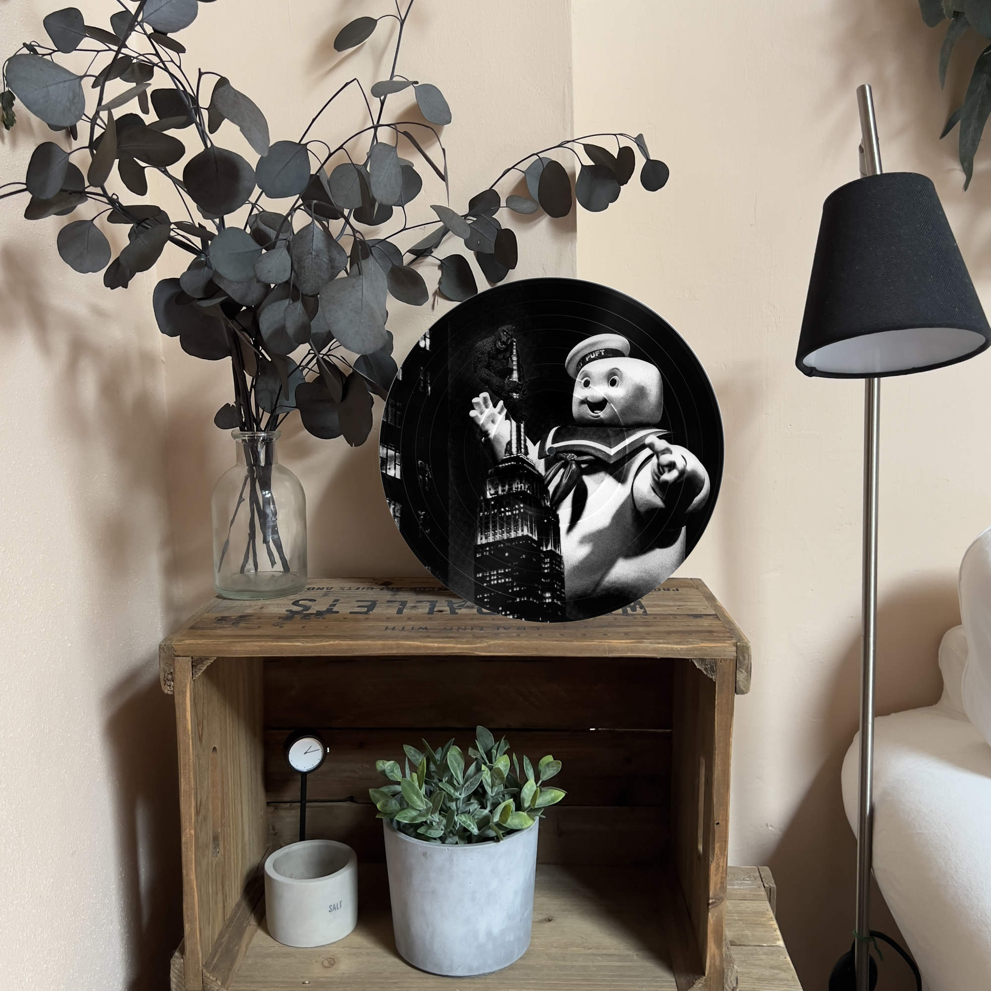 Upcycled vinyl record photo art of King Kong on the Empire State Building and Stay Puft reaching up from below, styled as living room wall decor.