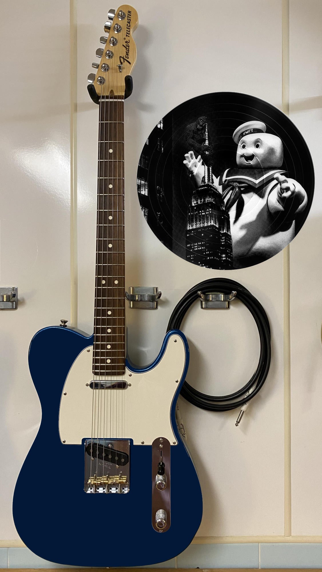 Black and white vinyl record photo art of King Kong and Stay Puft in New York City at night, featured in a recording studio setting.