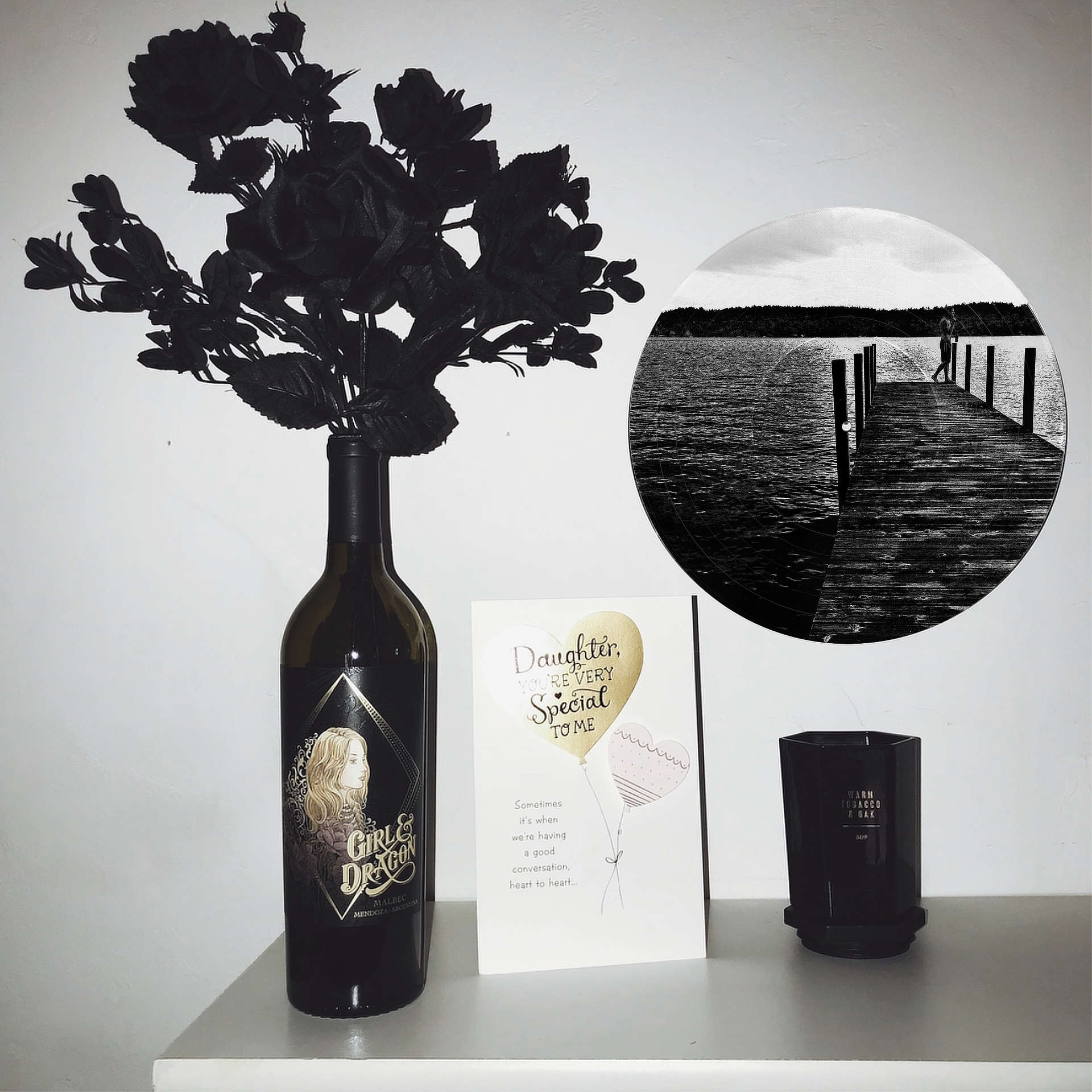 Lakeside Dock vinyl record wall art, a unique black and white music gift featuring a dock at sunrise over a calm lake.