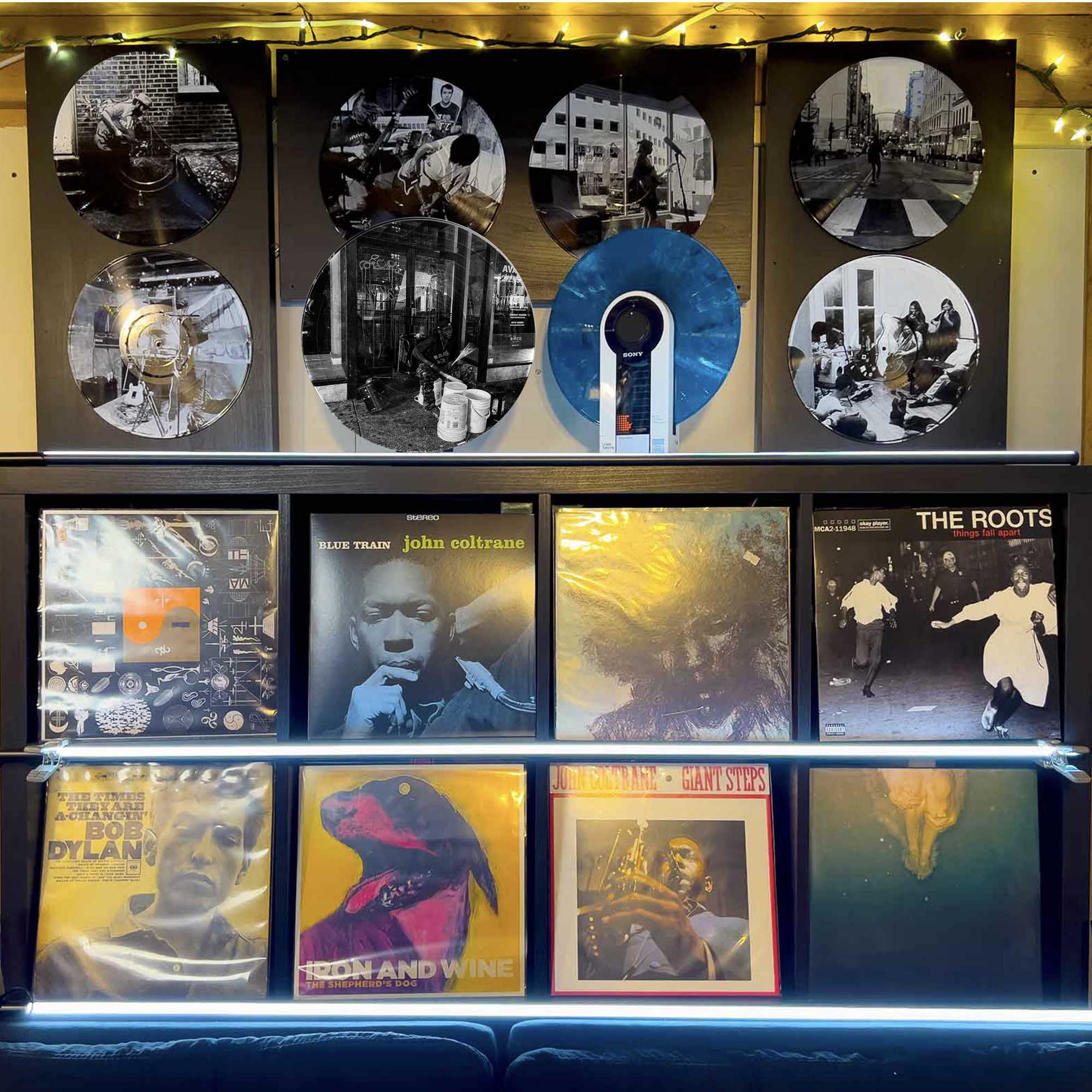 Vinyl record photo art featuring a street drummer in motion in New York City, styled on a gallery wall.