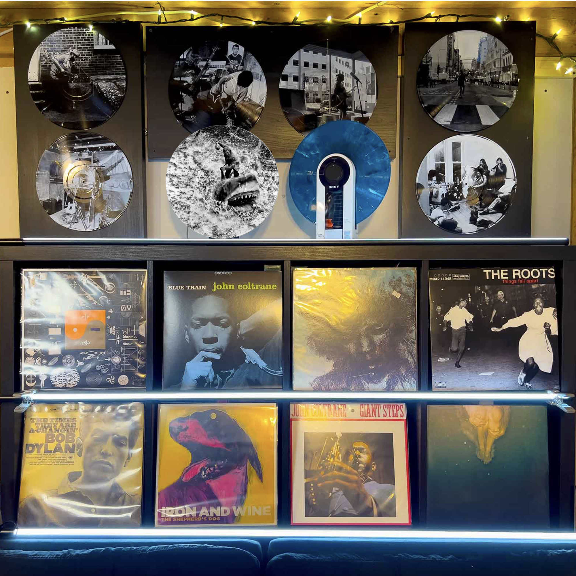 Vinyl record photo art featuring Quint and Bruce from Jaws with Narragansett beer, styled on a gallery wall.