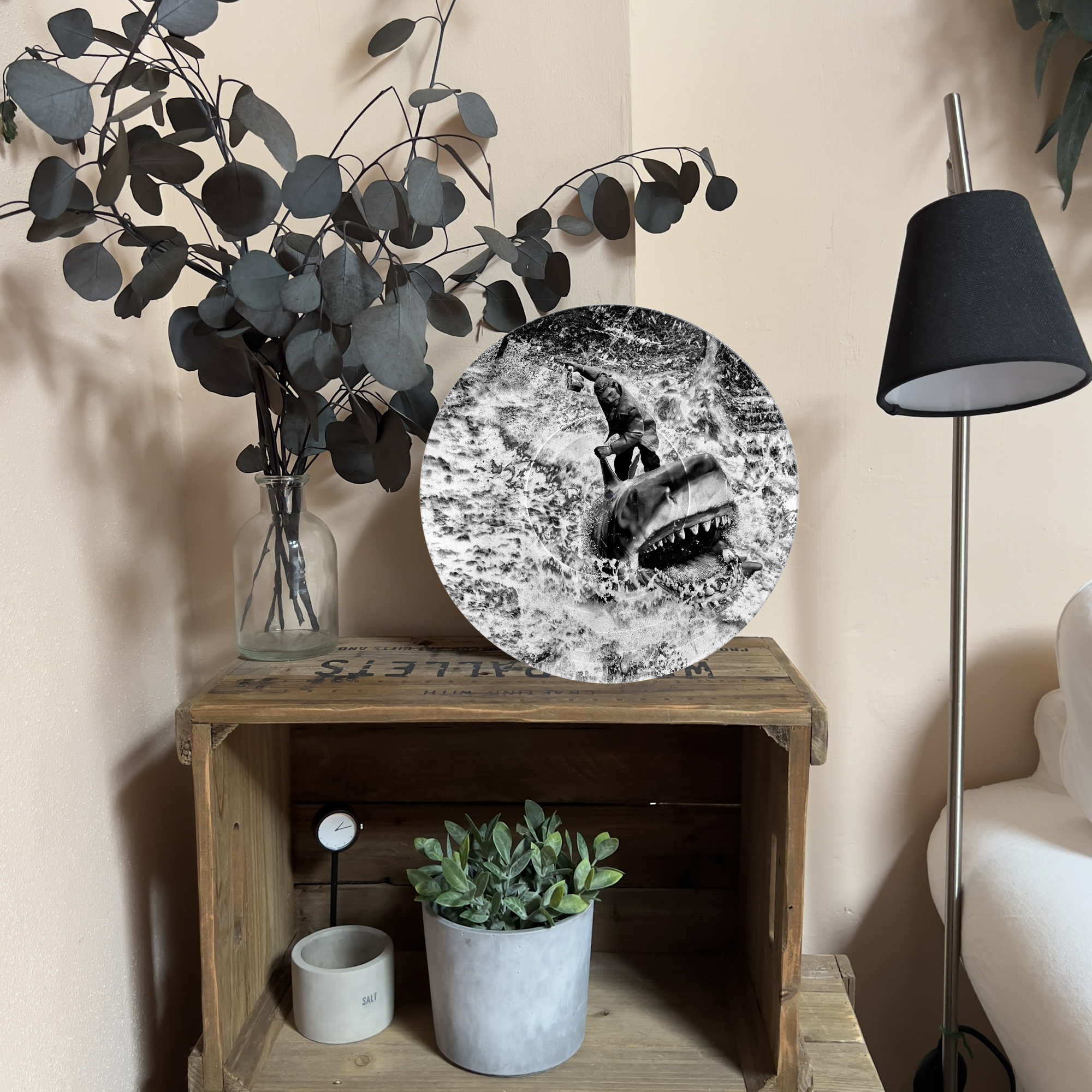 Upcycled vinyl record photo art of Quint riding Bruce the shark from Jaws, styled as living room wall decor.