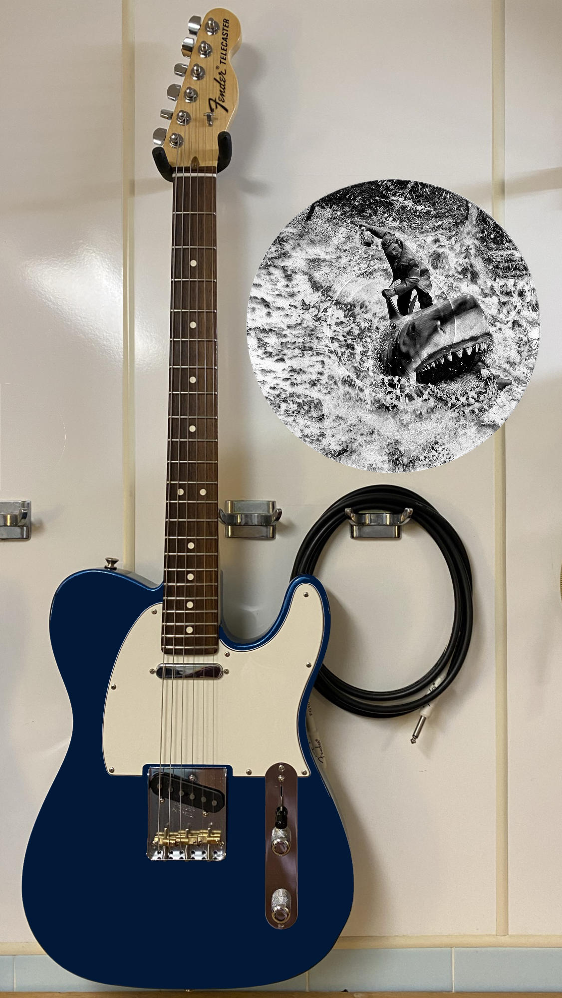 Black and white vinyl record photo art of Quint from Jaws riding Bruce the shark at sea, featured in a recording studio setting.