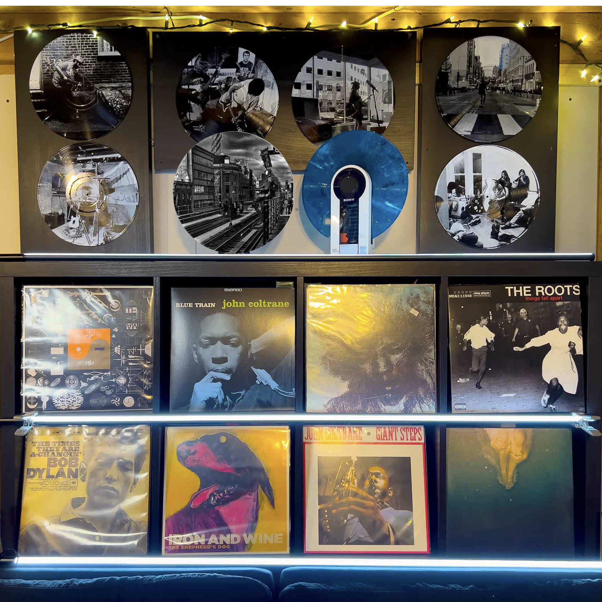 Vinyl record photo art featuring Spider-Punk at a Brooklyn train station, styled on a gallery wall.