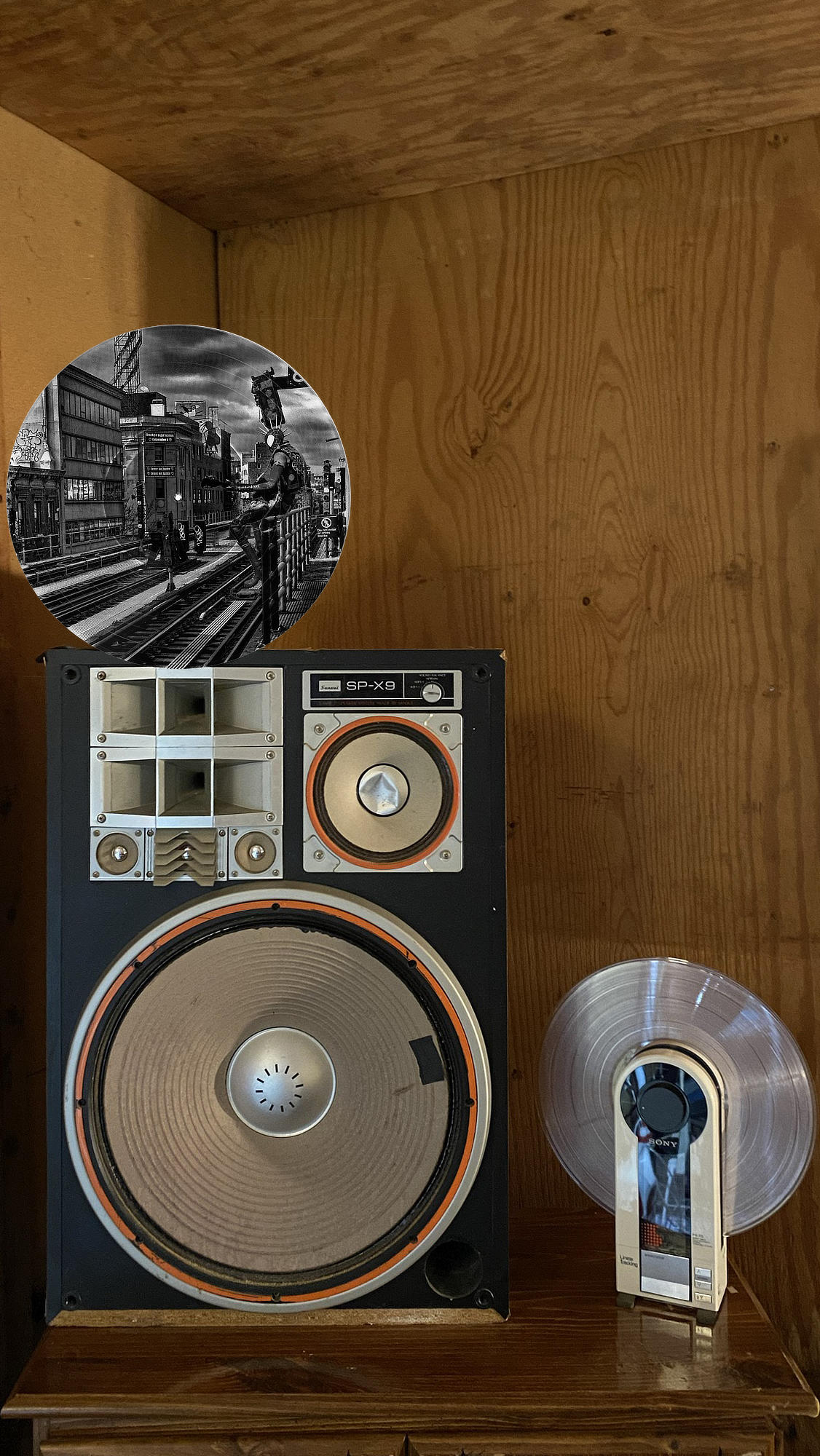 Circular vinyl record wall art of Spider-Punk playing guitar under graffiti-filled bridges in Brooklyn, displayed in a music room.