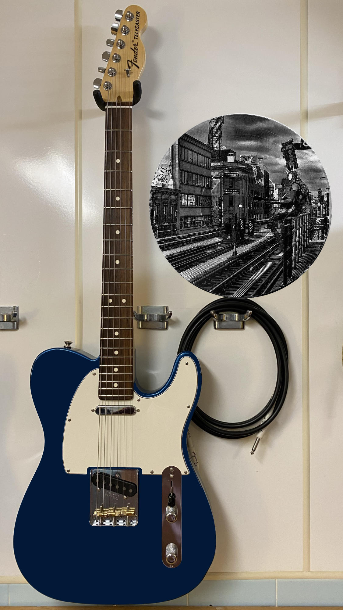 Black and white vinyl record photo art of Spider-Punk performing at a Brooklyn station, featured in a recording studio.